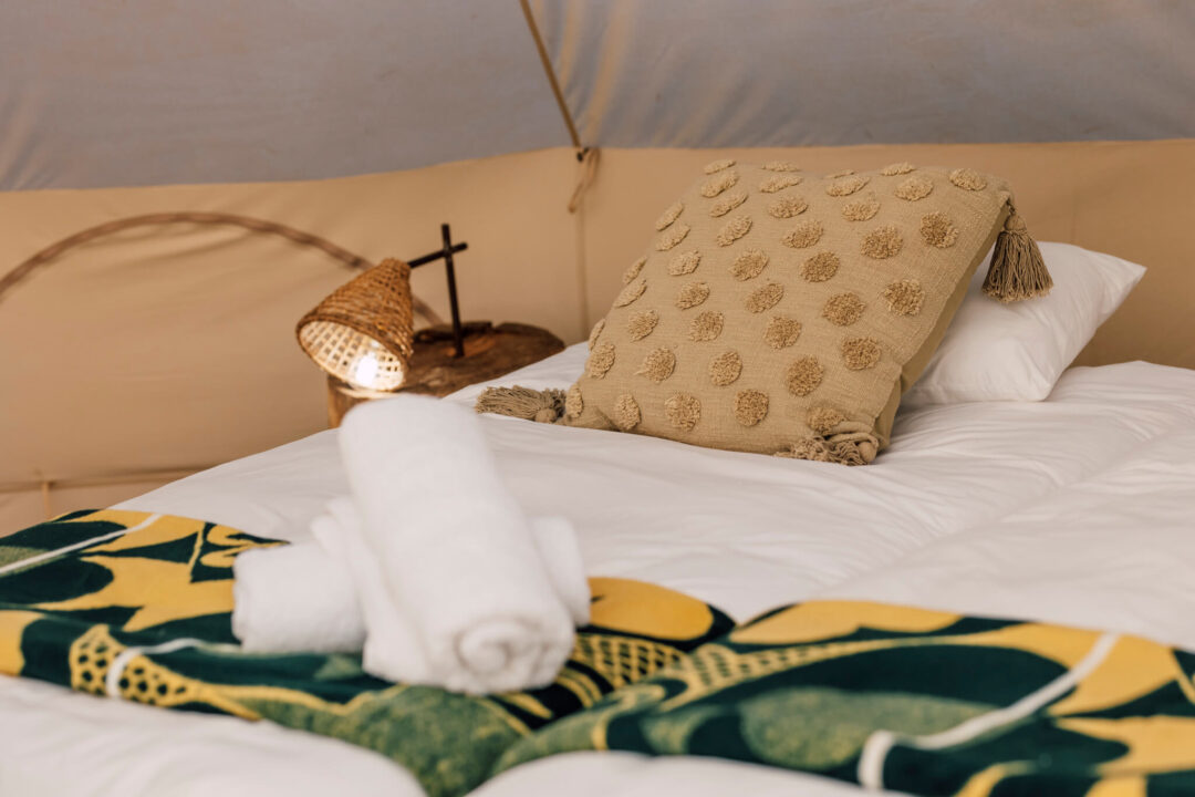 RTC-52 (1) Bedside lamp and patterned cushion on neutral bedding
