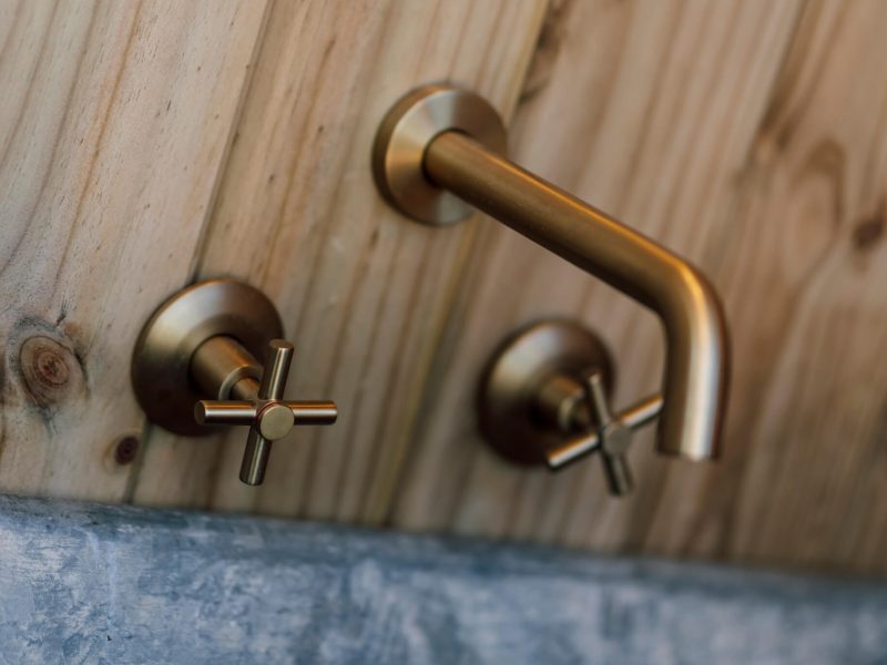 Brass handles and wooden surface detail