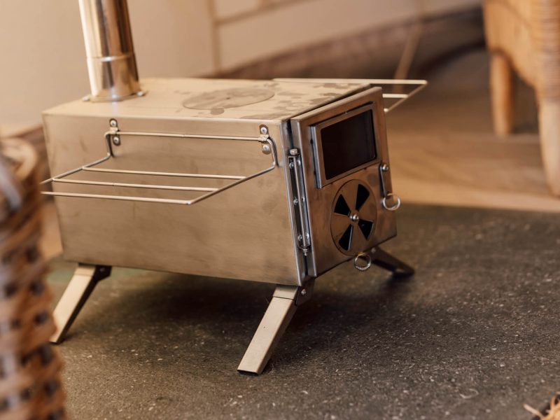 Portable wood stove on table at De Stilte
