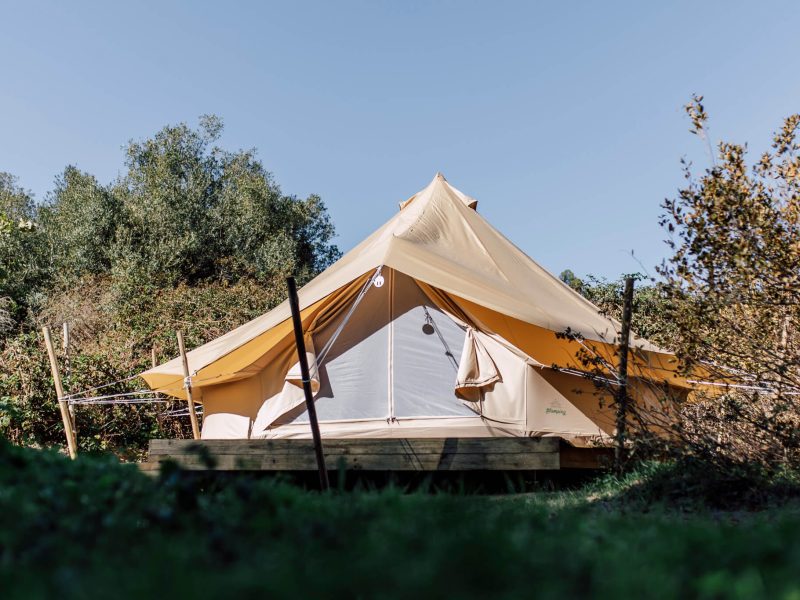 Tent entrance with timber posts and canvas canopy