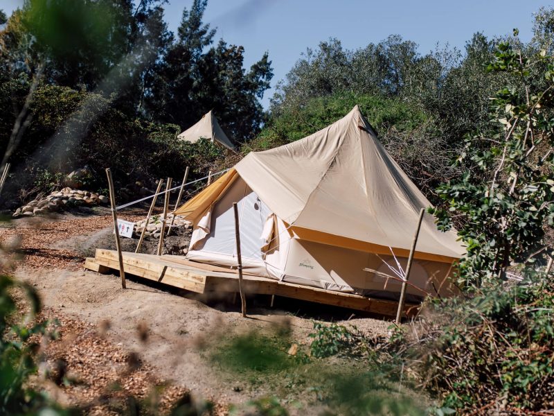 Canvas tent on deck with timber ramp and rails
