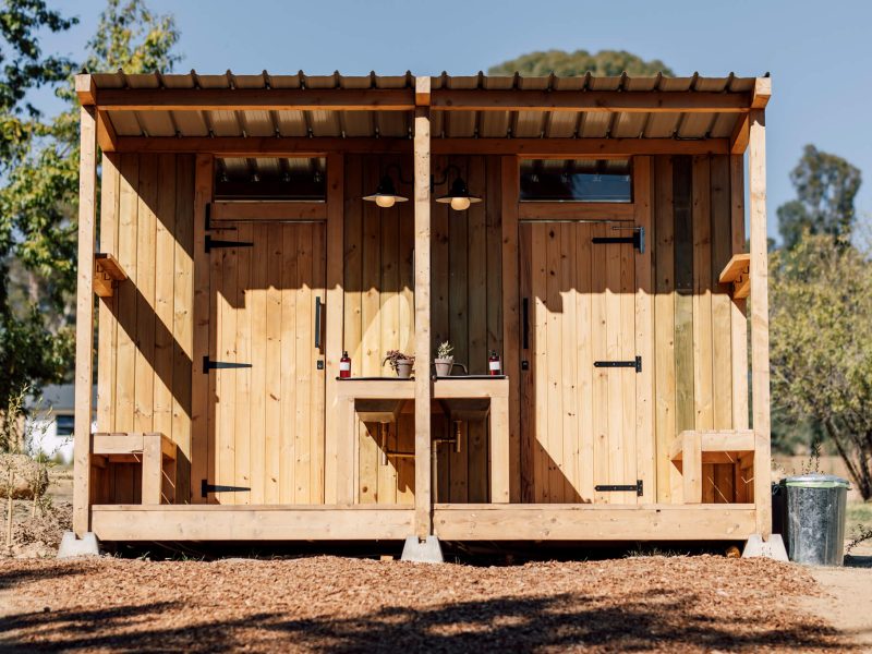 Wooden cabin exterior with double doors and step